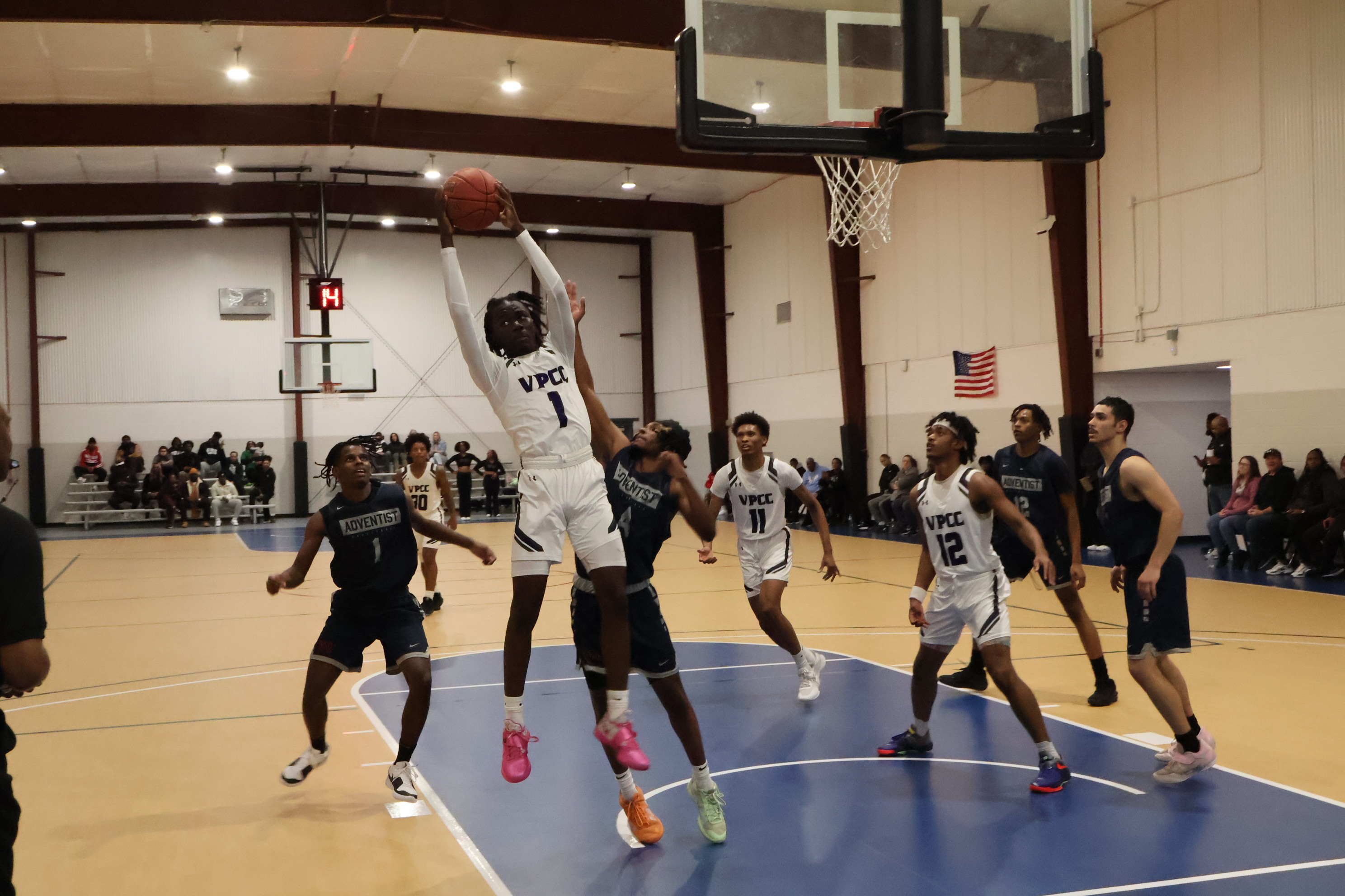 Emmanuel Angila goes up for a rebound against Washington Adventist.