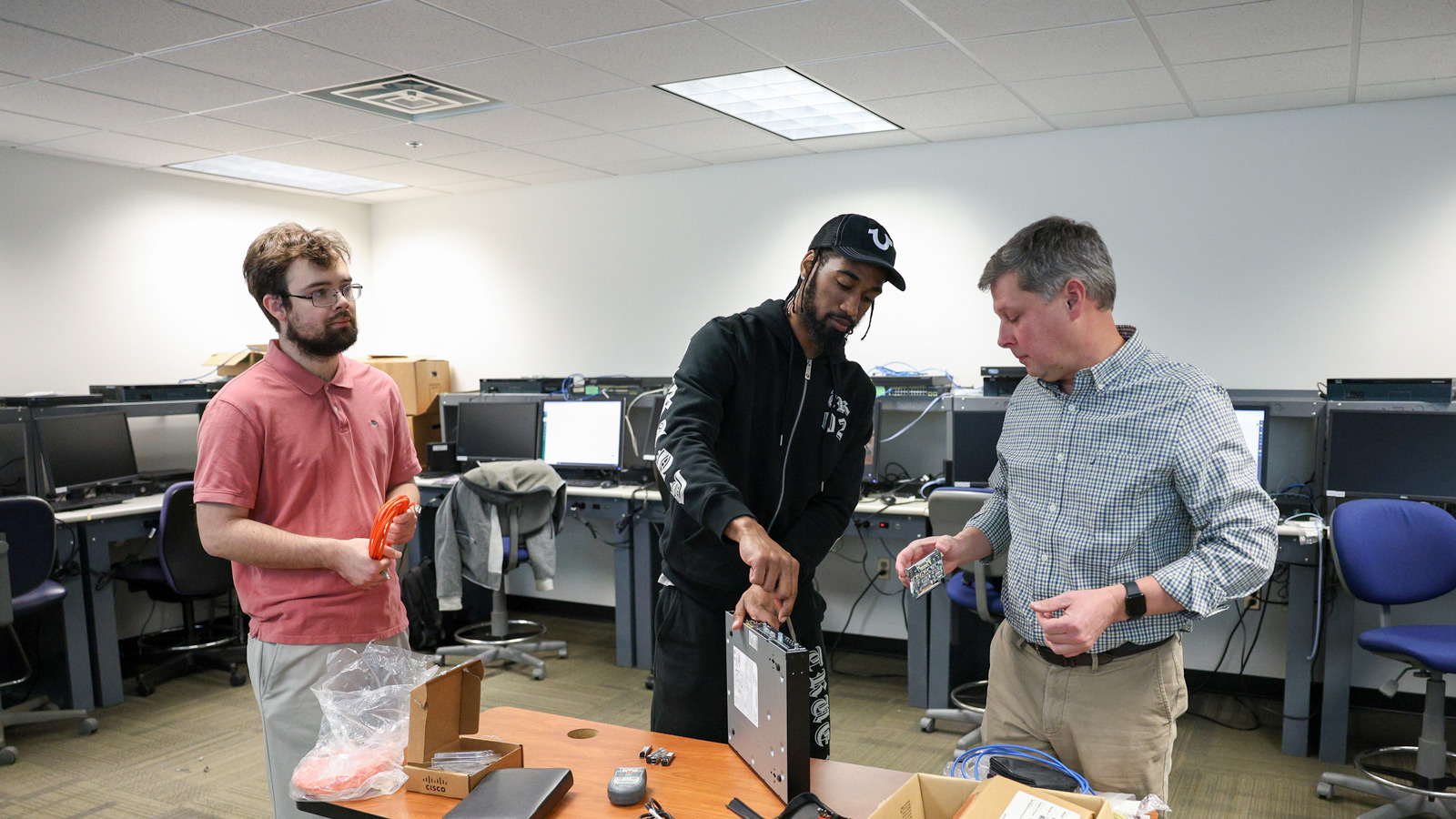 Students working in a networking class