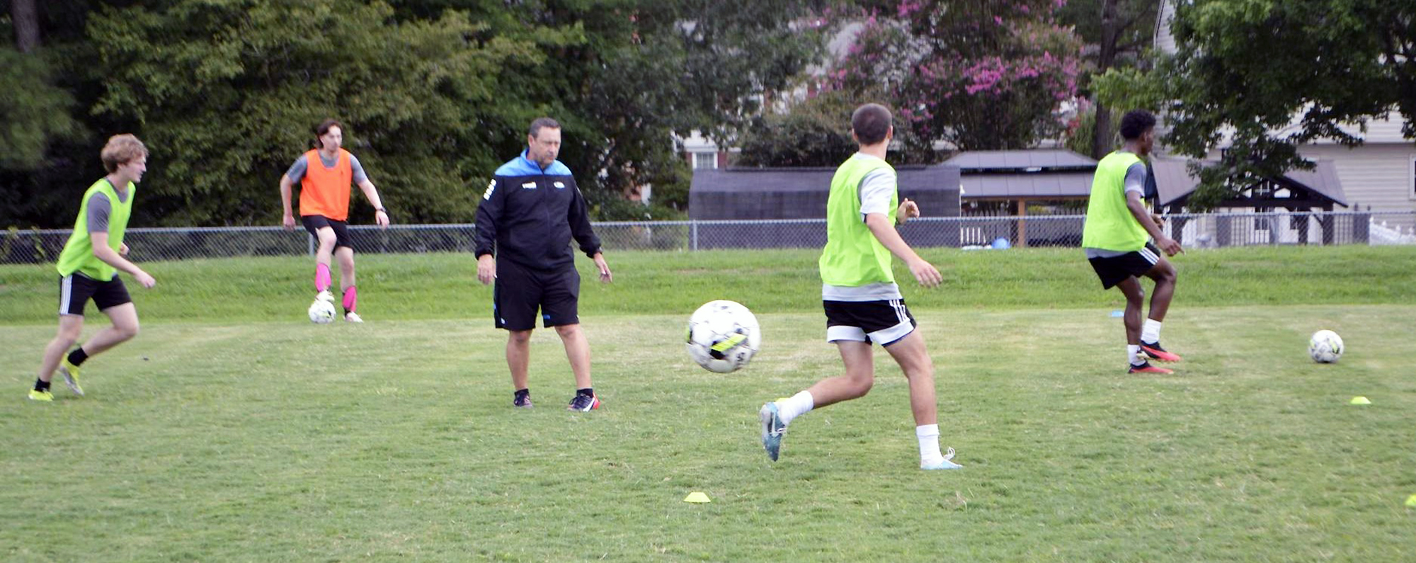 VPCC Men's Soccer coach Kevin Darcy and the Men's Soccer team during practice