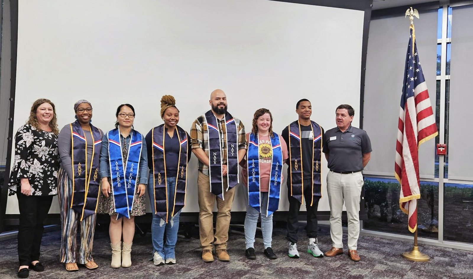 VPCC VERITAS liaison David Lannon (right) with graduate student veterans and faculty & staff