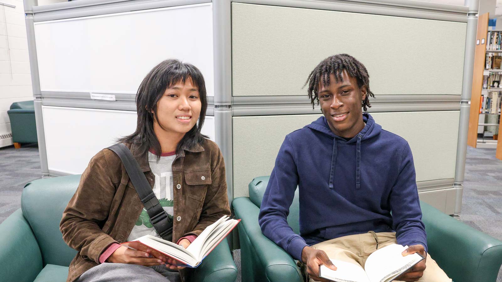 Scholarship FAQ Banner — two students reading books