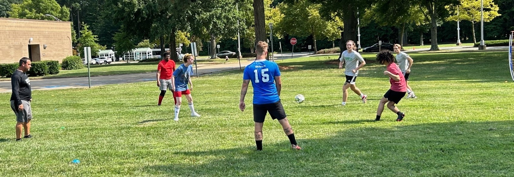 VPCC Soccer coach Kevin Darcy and the college's Soccer team during practice