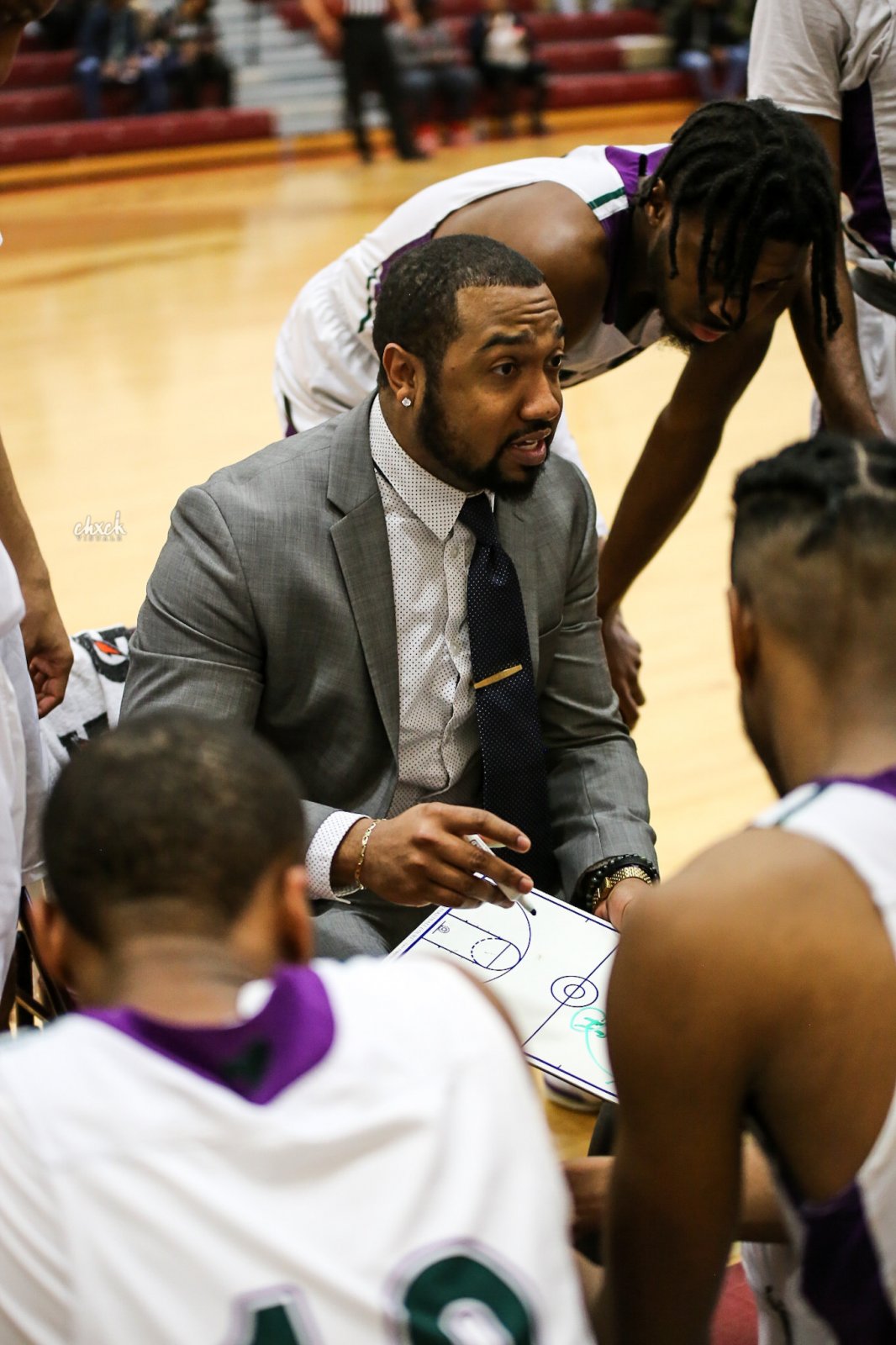 Men's basketball coach Chris Moore can relate to his players on and off the court.