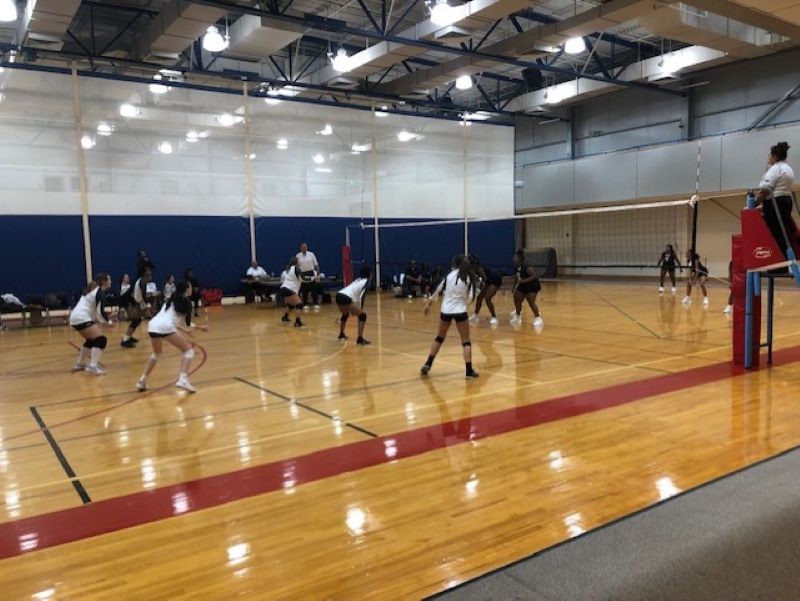 The VPCC volleyball team playing (in white tops)