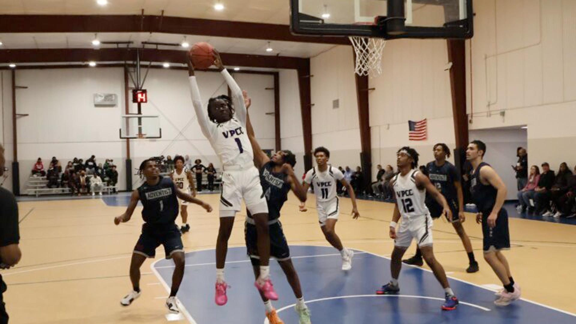 Emmanuel Angila goes up for a rebound against Washington Adventist.