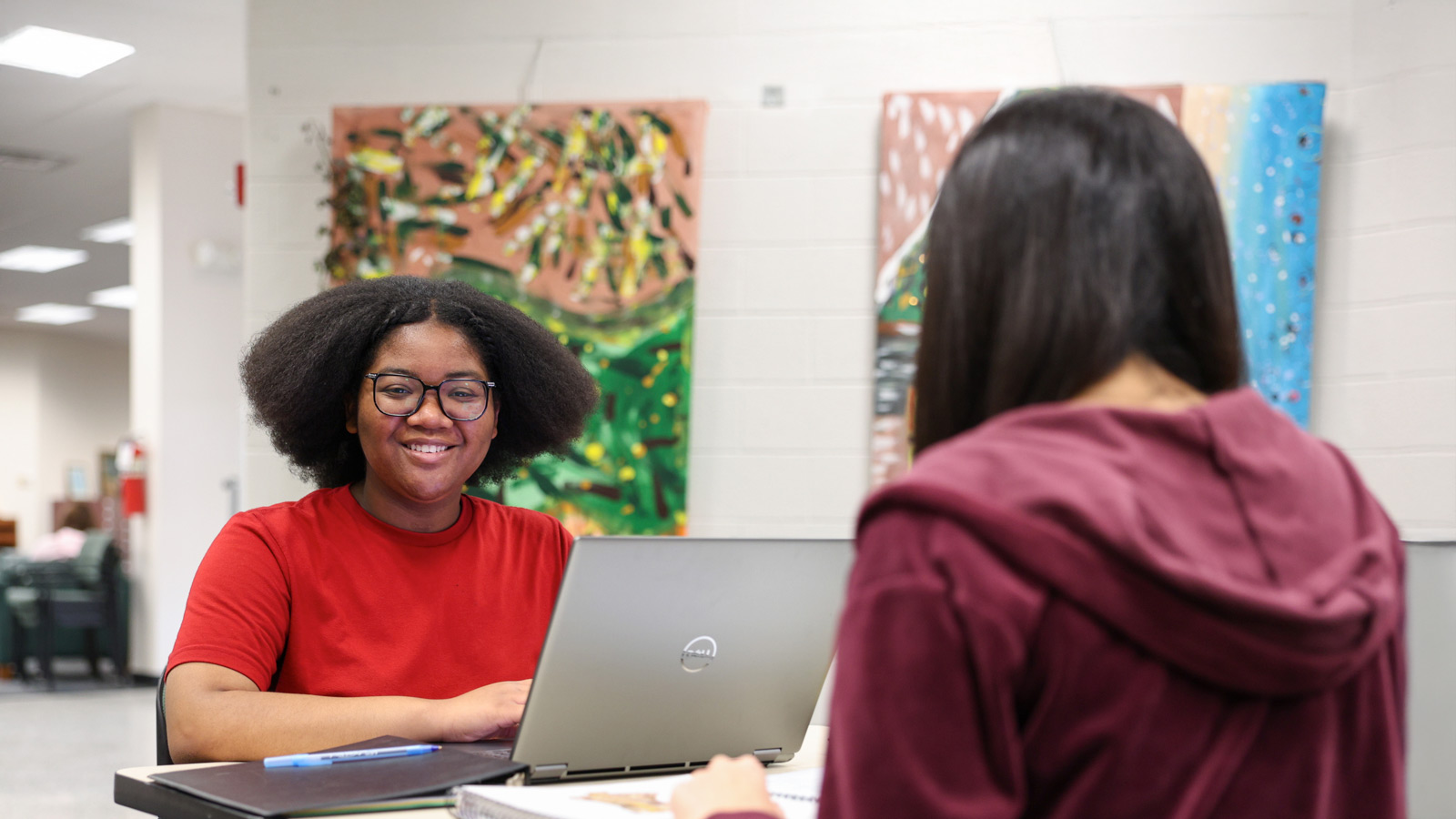 Financial Aid banner … two students studying