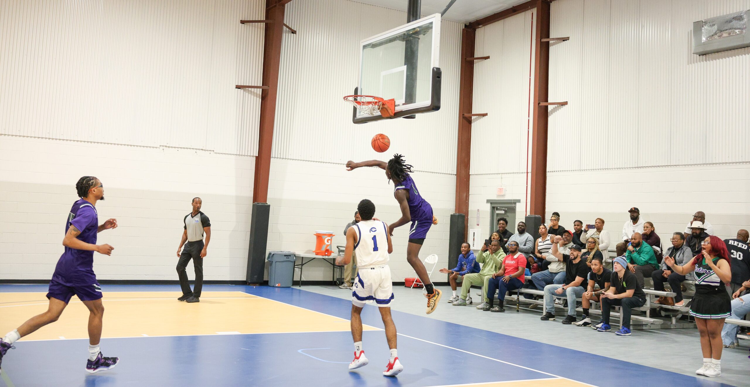 A breakaway dunk from a basketball athlete